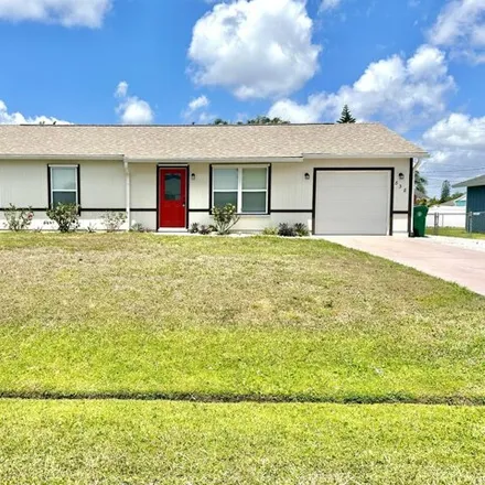 Rent this 3 bed house on 848 Southwest Curtis Street in Port Saint Lucie, FL 34983