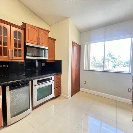 Buy this 2 bed townhouse on 7075 Northwest 173rd Drive in Palm Springs North, Miami-Dade County