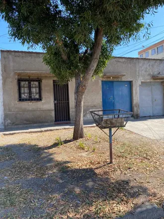 Buy this 4 bed house on Botillería San Carlos in Nueva Extremadura, 852 0512 Quinta Normal