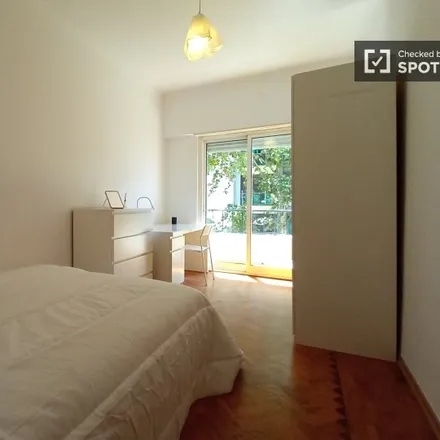 Rent this 3 bed room on Rua General Morais Sarmento in Avenida Gomes Pereira, 1500-328 Lisbon