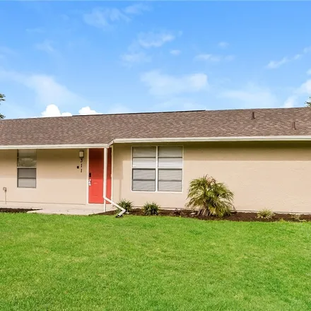 Rent this 3 bed house on 311 Dartmouth Avenue in Lehigh Acres, FL 33936