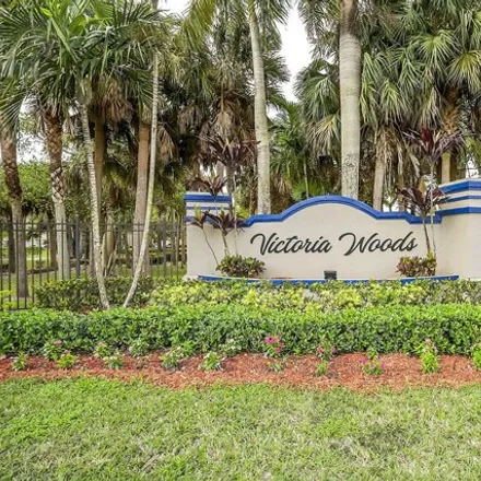 Buy this 3 bed house on 5521 Berry Blossom Way West in Palm Beach County, FL 33415