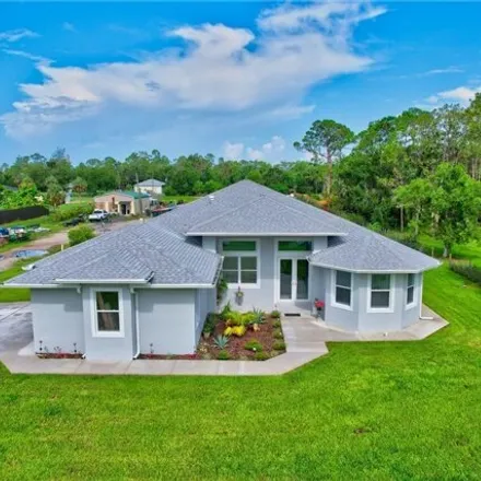 Buy this 4 bed house on 7316 Eastwood Acres Road in Lee County, FL 33905