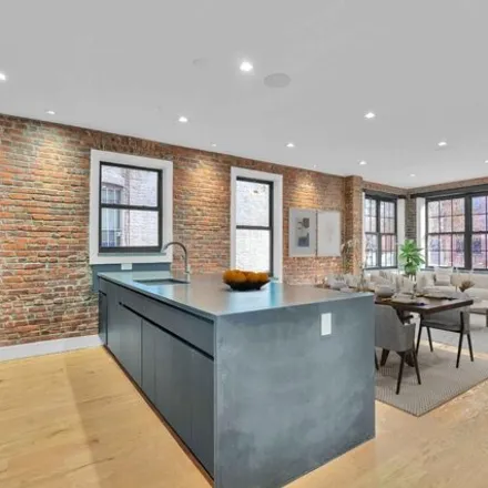 Buy this 5 bed house on 909 Willoughby Avenue in New York, NY 11221