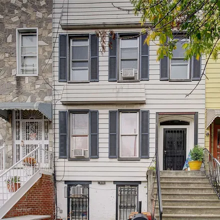 Buy this 6 bed townhouse on 1194 Halsey Street in New York, NY 11207
