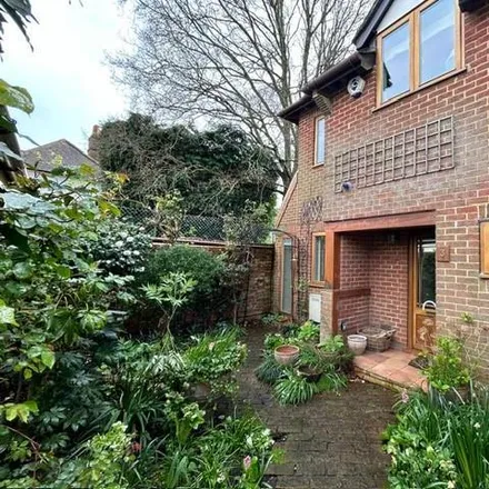 Rent this 3 bed townhouse on The Cloisters in Old Woking, GU22 9JB