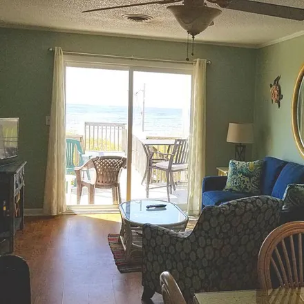 Rent this 4 bed house on Caswell Beach