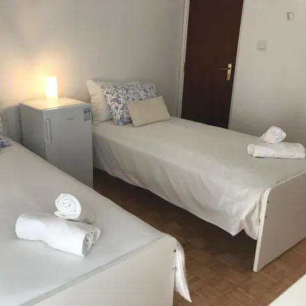 Rent this 8 bed room on Rua Ferreira de Castro 333 in 1950-136 Lisbon, Portugal