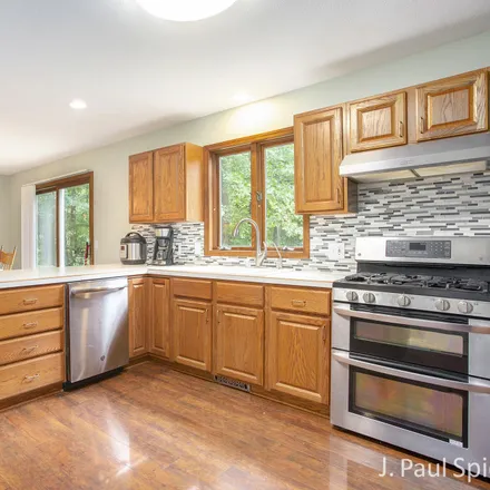 Image 4 - 12059 Blue Spruce Court Northeast, Oakfield Township, MI 49341, USA - House for sale