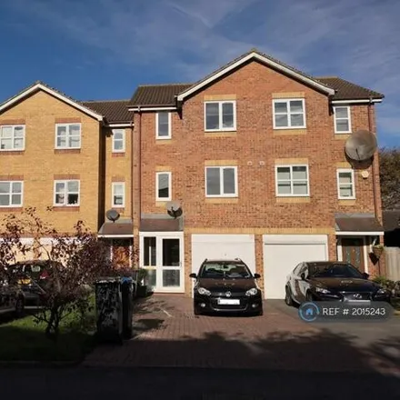 Rent this 4 bed townhouse on Donald Woods Gardens in London, KT5 9NZ