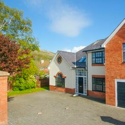 Buy this 4 bed house on Vicarage Avenue in Llanrhos, LL30 1PS