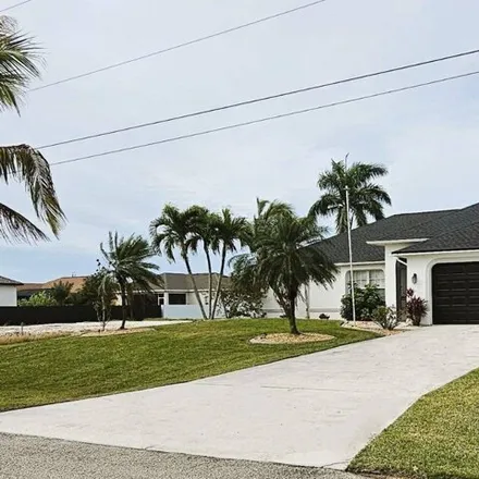 Rent this 4 bed house on 1046 Northwest 33rd Place in Cape Coral, FL 33993