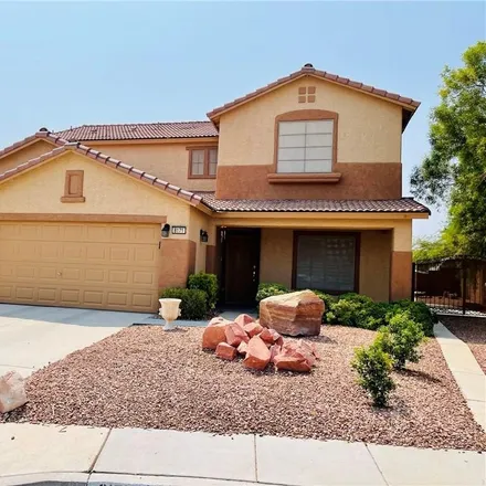 Rent this 4 bed loft on 8167 Petunia Flower Way in Spring Valley, NV 89147