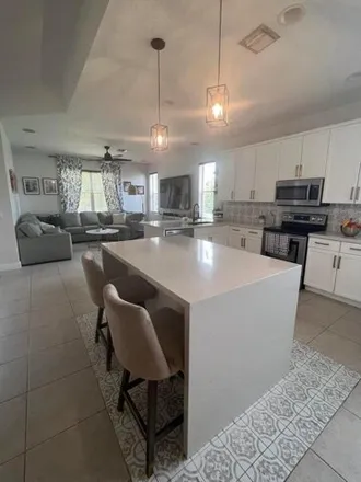 Rent this 3 bed house on Seminole Lake Drive in Royal Palm Beach, Palm Beach County