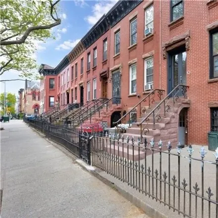 Buy this 5 bed townhouse on 214 Patchen Avenue in New York, NY 11233
