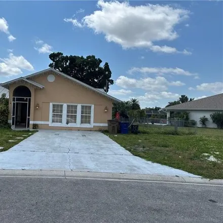 Rent this 4 bed house on 734 Arianne Court in Lehigh Acres, FL 33936