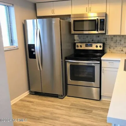 Rent this 2 bed condo on 4443 Holly Tree Road in Wilmington, NC 28412