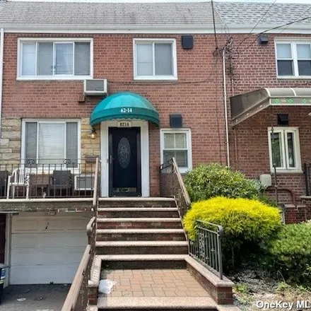 Buy this 4 bed townhouse on 62-14 69th Place in New York, NY 11379