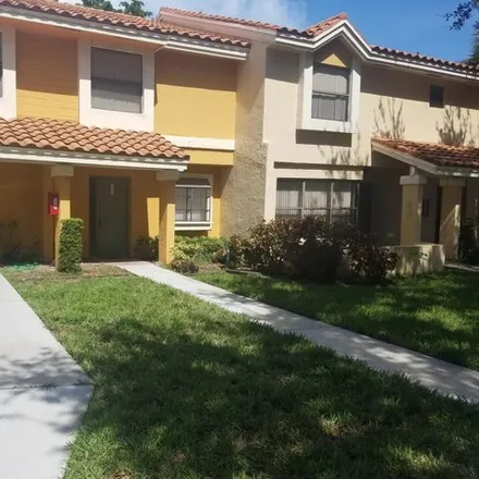 Rent this 2 bed townhouse on Coral Tree Terrace in Coconut Creek, FL 33066