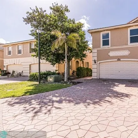 Buy this 3 bed house on 3572 Lakewood Place in Coconut Creek, FL 33073