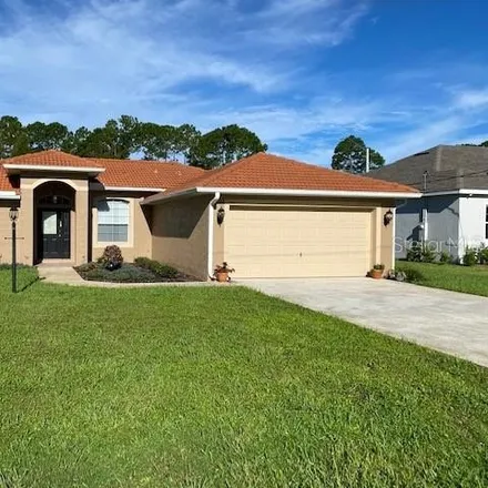 Rent this 3 bed house on 12 Point of Woods Drive in Palm Coast, FL 32164