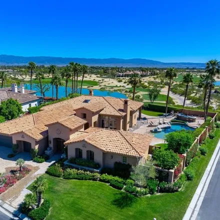 Buy this 4 bed house on Greg Norman Course Resort Course (PGA West) in Brown Deer Park, La Quinta