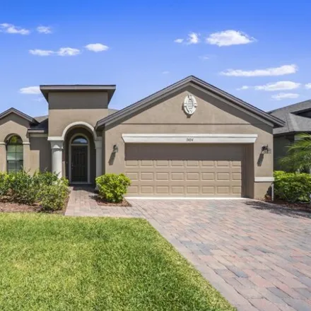 Rent this 4 bed house on 1588 Musgrass Circle in West Melbourne, FL 32904