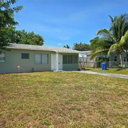 Rent this 3 bed house on 638 Northeast 59th Court in Broward County, FL 33334