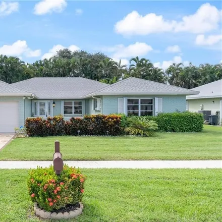 Buy this 3 bed house on 10911 Greentrail Drive South in Palm Beach County, FL 33436