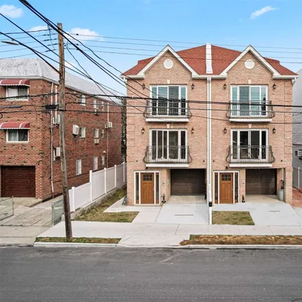 Buy this 5 bed townhouse on 66-23 73rd Place in New York, NY 11379