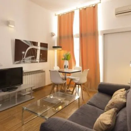 Rent this 4 bed apartment on Madrid in Casa García, Calle de Atocha