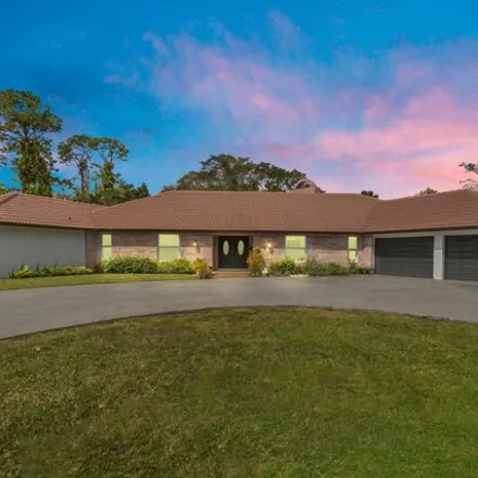 Buy this 4 bed house on 12397 Areaca Drive in Wellington, FL 33414