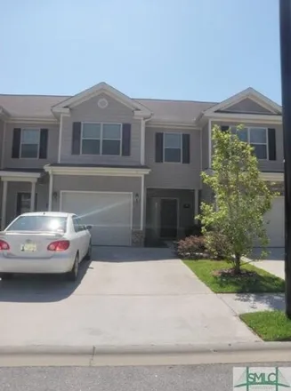 Rent this 3 bed townhouse on 585 Canyon Oak Loop in Richmond Hill, GA 31324