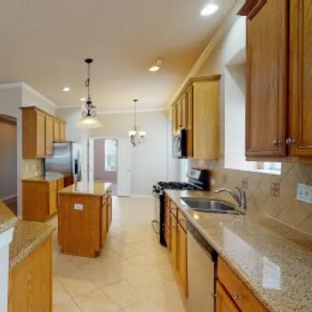 Rent this 4 bed apartment on 6025 Churchside Drive in Fish Hawk Ranch, Lithia