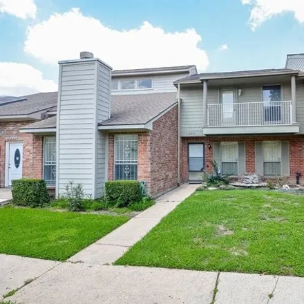Buy this 2 bed townhouse on 9355 Westwood Village Drive in Houston, TX 77036