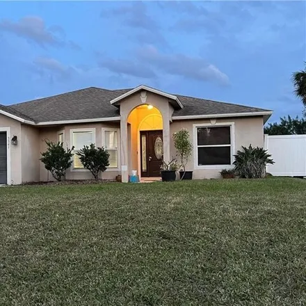 Buy this 3 bed house on 3341 Sw Freedom Ave in Palm Bay, Florida