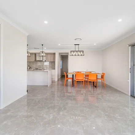 Rent this 4 bed apartment on Farmstead Avenue in Thrumster NSW 2444, Australia