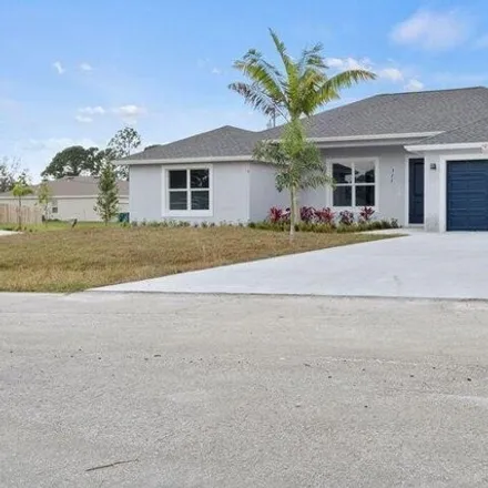 Buy this 4 bed house on 5821 Dooley Circle in Port Saint Lucie, FL 34986