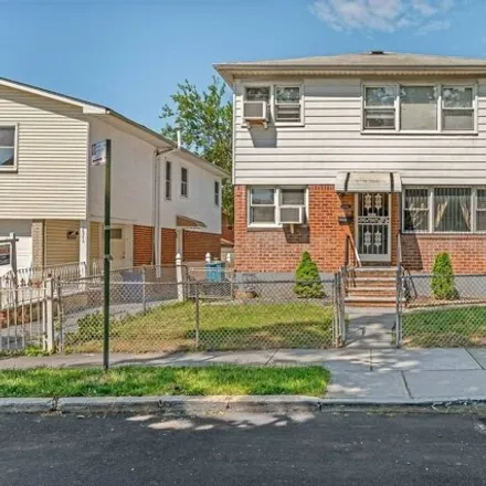 Buy this 4 bed house on 23-40 97th Street in New York, NY 11369