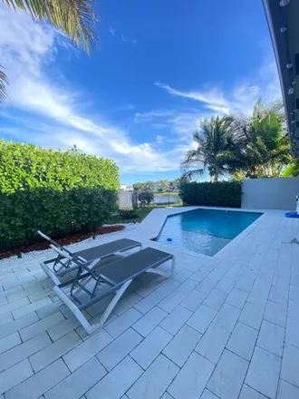 Rent this 3 bed house on Sea Blossom Way in Palm Beach County, FL 33496