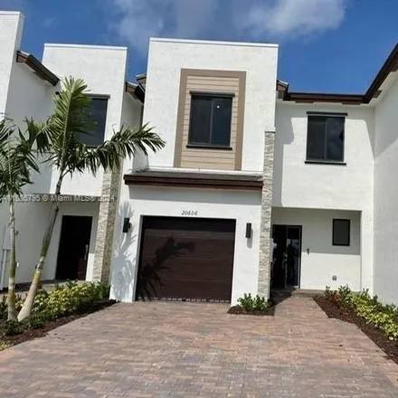 Rent this 3 bed townhouse on Northeast 5th Place in Miami-Dade County, FL 33179