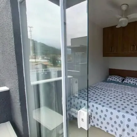 Rent this 3 bed house on Rua Sidnei de Oliveira Andrade in Massaguaçú, Caraguatatuba - SP