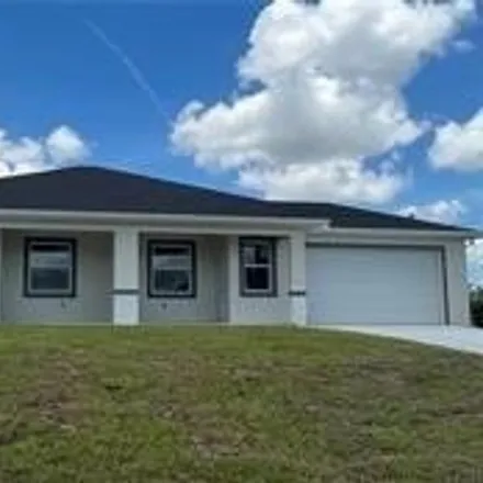 Rent this 3 bed house on 2469 Paul Avenue in Lehigh Acres, FL 33973