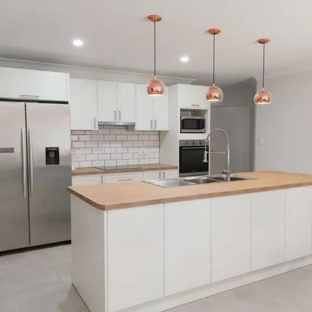 Rent this 4 bed apartment on 3 Tantanoola Street in Parkinson QLD 4115, Australia