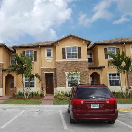 Rent this 2 bed townhouse on 10208 Southwest 227th Lane in Miami-Dade County, FL 33190