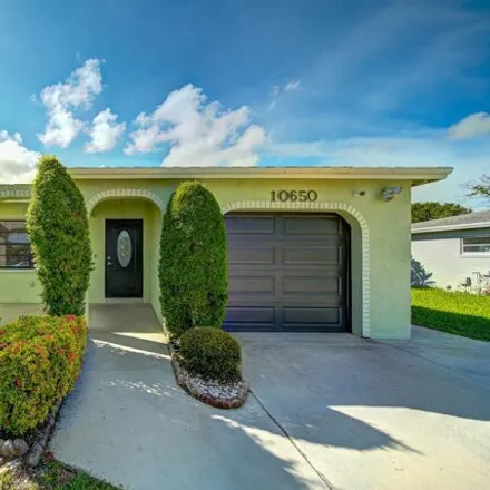 Rent this 4 bed house on 10556 Ermine Avenue in Palm Beach County, FL 33428
