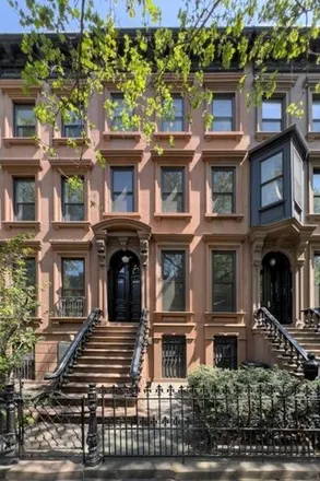 Rent this 3 bed townhouse on 129 Park Place in New York, NY 11217