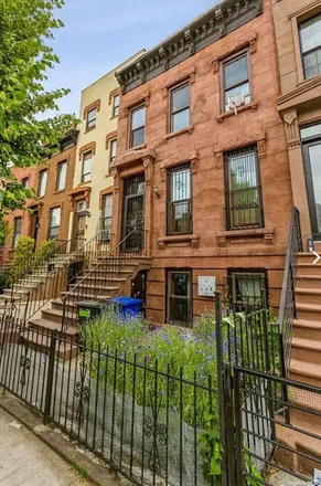 Rent this 2 bed apartment on 317 Quincy Street in New York, NY 11216