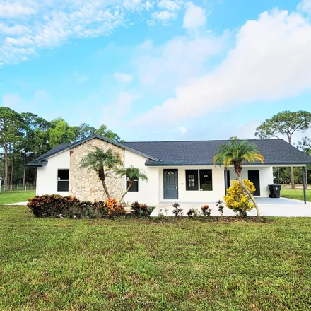 Rent this 3 bed house on 13859 Northwest 62nd Drive in Palm Beach County, FL 33412