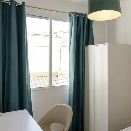 Rent this 4 bed room on Farmàcia Josep M. Puig Romeu in Carrer del Progrés, 39